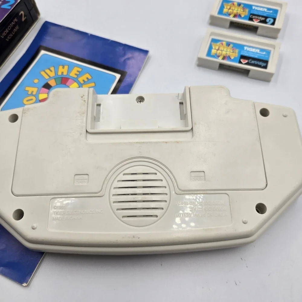 1995 Tiger Hand Held Electronic Wheel Of Fortune Expansion Cartridges Book & VHS